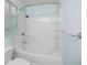 Clean bathroom featuring a tub with tiled walls and a modern shower head at 1293 Liberty Nw Pkwy, Atlanta, GA 30318
