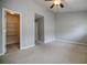 Spacious bedroom with closet access, neutral paint, and a ceiling fan at 1293 Liberty Nw Pkwy, Atlanta, GA 30318
