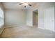Bright bedroom with a ceiling fan, neutral walls, and carpeted flooring at 1293 Liberty Nw Pkwy, Atlanta, GA 30318