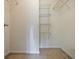 Walk in closet with shelving to maximize storage and organization at 1293 Liberty Nw Pkwy, Atlanta, GA 30318