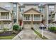 Inviting townhouse exteriors with private garages, balconies, and well-maintained landscaping at 1293 Liberty Nw Pkwy, Atlanta, GA 30318