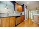 Kitchen with stainless steel appliances and hardwood floors offers great flow into adjacent rooms at 1293 Liberty Nw Pkwy, Atlanta, GA 30318