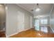 Open-concept living area with hardwood floors, natural light, and easy access to other rooms at 1293 Liberty Nw Pkwy, Atlanta, GA 30318