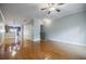 Spacious living room with hardwood floors, neutral colors, and a seamless transition to the kitchen at 1293 Liberty Nw Pkwy, Atlanta, GA 30318