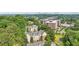 Aerial view featuring buildings surrounded by lush greenery, under a blue sky with a cityscape in distance at 3108 Westchester Ne Rdg, Atlanta, GA 30329