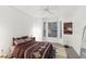 Cozy bedroom boasts a decorative rug, a ceiling fan, and natural lighting at 3108 Westchester Ne Rdg, Atlanta, GA 30329