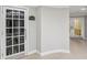 Well lit cinema room entrance featuring white walls, trim, and french doors for residents at 3108 Westchester Ne Rdg, Atlanta, GA 30329
