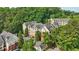 Exterior shot of buildings with lush trees and landscaped areas, under a bright blue sky on a sunny day at 3108 Westchester Ne Rdg, Atlanta, GA 30329