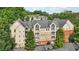 Multi-level building with a mix of light and brick facade, balconies and lush greenery surrounding it at 3108 Westchester Ne Rdg, Atlanta, GA 30329
