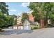 Exterior shot of garages near a building with lush trees in the background, under a sunny sky at 3108 Westchester Ne Rdg, Atlanta, GA 30329
