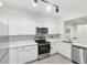 Renovated kitchen with white countertops, cabinets, and stainless steel appliances at 3108 Westchester Ne Rdg, Atlanta, GA 30329