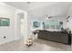 Spacious living room featuring a comfortable couch, tile flooring, and a large screen television at 3108 Westchester Ne Rdg, Atlanta, GA 30329