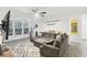 Bright living room featuring a large sectional sofa, decorative rug, and bay window with natural light at 3108 Westchester Ne Rdg, Atlanta, GA 30329