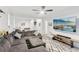 Spacious living room featuring a comfortable couch, tile flooring, and a large screen television at 3108 Westchester Ne Rdg, Atlanta, GA 30329