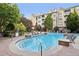 Resort-style community swimming pool with lounge chairs and lush landscaping near the building at 3108 Westchester Ne Rdg, Atlanta, GA 30329