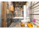 Stylish bathroom with decorative tile, shower and tub combo, toilet, and dark wood accents at 943 Peachtree Ne St # 2001, Atlanta, GA 30309
