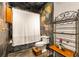 Stylish bathroom with decorative tile, shower and tub combo, toilet, and dark wood accents at 943 Peachtree Ne St # 2001, Atlanta, GA 30309