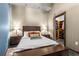 Comfortable bedroom featuring a king bed, bedside tables with lamps, and a walk-in closet at 943 Peachtree Ne St # 2001, Atlanta, GA 30309
