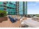 A luxurious apartment deck area features a cozy fire pit and comfortable seating for social gatherings at 943 Peachtree Ne St # 2001, Atlanta, GA 30309