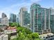 Beautiful shot of a modern high-rise building nestled in a vibrant cityscape with lush greenery at 943 Peachtree Ne St # 2001, Atlanta, GA 30309