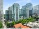 Modern high-rise building showcasing balconies, an attached parking garage, and a lively downtown cityscape at 943 Peachtree Ne St # 2001, Atlanta, GA 30309