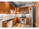 Well-equipped kitchen boasts stainless steel appliances, granite countertops, and sleek wooden cabinetry at 943 Peachtree Ne St # 2001, Atlanta, GA 30309