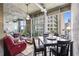 Bright living room with floor-to-ceiling windows and a cozy seating area at 943 Peachtree Ne St # 2001, Atlanta, GA 30309