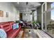 Bright living room with floor-to-ceiling windows, hardwood floors, and comfortable seating at 943 Peachtree Ne St # 2001, Atlanta, GA 30309