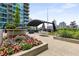 A communal outdoor lounge area with stylish furniture and vibrant flower beds that enhances relaxation at 943 Peachtree Ne St # 2001, Atlanta, GA 30309