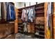 Spacious walk-in closet with custom built-in shelving for ample storage and organization at 943 Peachtree Ne St # 2001, Atlanta, GA 30309