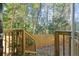 A fenced backyard showing the landscape and natural features at 2140 Wildcat Cliffs Way, Lawrenceville, GA 30043