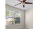 Cozy bedroom featuring a ceiling fan and a large window with blinds at 2140 Wildcat Cliffs Way, Lawrenceville, GA 30043