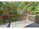 An elevated deck looking out over wooded property at 2140 Wildcat Cliffs Way, Lawrenceville, GA 30043