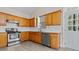 Charming kitchen featuring wooden cabinets, stainless steel appliances, and a bright, welcoming atmosphere at 2140 Wildcat Cliffs Way, Lawrenceville, GA 30043