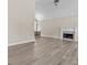 Spacious living room featuring hardwood floors, a fireplace, and an open layout ideal for entertaining at 2140 Wildcat Cliffs Way, Lawrenceville, GA 30043