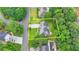 Aerial view of property with a well-manicured lawn, landscaping, a home and a defined yellow border in a wooded neighborhood at 3085 Saint Andrews Dr, Duluth, GA 30096