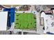 Aerial view of a multi-purpose play field with colorful artificial turf and recreational tables and chairs at 3085 Saint Andrews Dr, Duluth, GA 30096