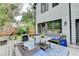 Outdoor patio featuring cozy seating, table, and a lush green yard with privacy fence and plantings at 3085 Saint Andrews Dr, Duluth, GA 30096