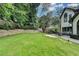 Expansive backyard featuring a lush lawn and a spacious patio area, perfect for outdoor entertaining at 3085 Saint Andrews Dr, Duluth, GA 30096