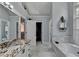 Bathroom with double sink vanity, soaking tub and walk-in closet at 3085 Saint Andrews Dr, Duluth, GA 30096