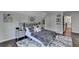 Cozy bedroom featuring a plush bed, accent wall art, and a soft rug over hardwood floors at 3085 Saint Andrews Dr, Duluth, GA 30096
