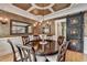 Formal dining room with coffered ceilings, hardwood floors, and decorative barn door at 3085 Saint Andrews Dr, Duluth, GA 30096