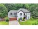 Beautiful two-story home featuring a well-kept lawn, attached garage, and traditional architecture, great for Gathering living at 3085 Saint Andrews Dr, Duluth, GA 30096