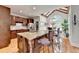Eat-in kitchen featuring a large island, wood cabinets, and a sunlit breakfast nook at 3085 Saint Andrews Dr, Duluth, GA 30096