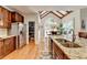 Kitchen with granite countertops, wood cabinets, stainless steel refrigerator and eat-in breakfast nook at 3085 Saint Andrews Dr, Duluth, GA 30096