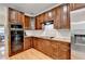 Well-equipped kitchen features custom cabinetry, granite countertops, and modern appliances for culinary enthusiasts at 3085 Saint Andrews Dr, Duluth, GA 30096