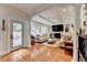 Bright living room features coffered ceilings, plush seating, and outdoor views for relaxation and enjoyment at 3085 Saint Andrews Dr, Duluth, GA 30096
