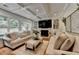 Bright living room with hardwood floors, coffered ceilings, and a fireplace at 3085 Saint Andrews Dr, Duluth, GA 30096