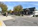 A charming street view showcasing local business storefronts under a clear sky at 3085 Saint Andrews Dr, Duluth, GA 30096