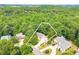 Aerial image showing the home and surrounding property lines; showcases proximity to other homes and the dense, wooded neighborhood at 3440 Canyon Oak Way, Cumming, GA 30041